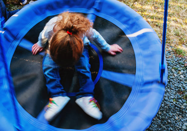 istock Girl on Backyard Swing 1223505188