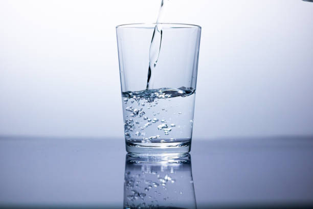 istock Filling a glass with water 1223505664