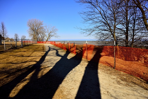 Contrast of Long Winter Shadow with Orange Snow Fence