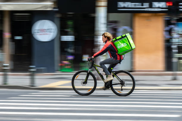 Food delivery courier - state of emergency due to coronavirus - Bucharest, Romania stock photo