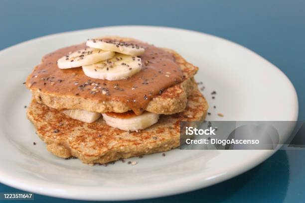 Oat Pancakes With Peanut Butter And Banana Stock Photo - Download Image Now - Pancake, Banana, Oat - Crop