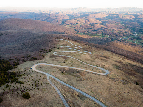 Aerial perspective of the Appalachian Trail and the summit of Whitetop Mountain in southwestern Virginia during golden hour.