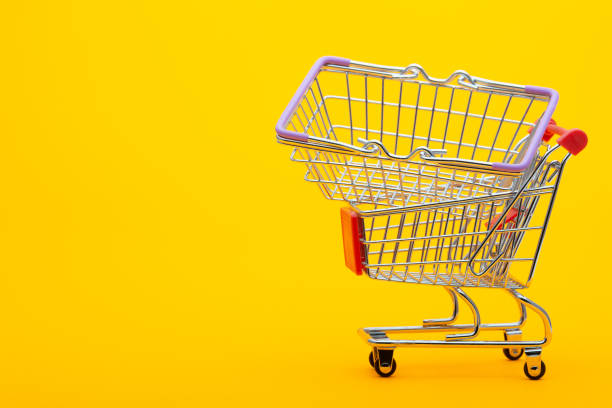 istock In an empty grocery cart lies an empty grocery basket 1223517230