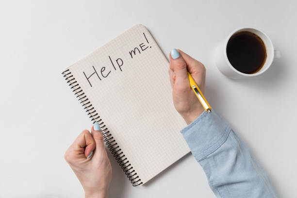 istock Notebook with inscription - Help me. Request for assistance. Women's violence concept. 1223517514