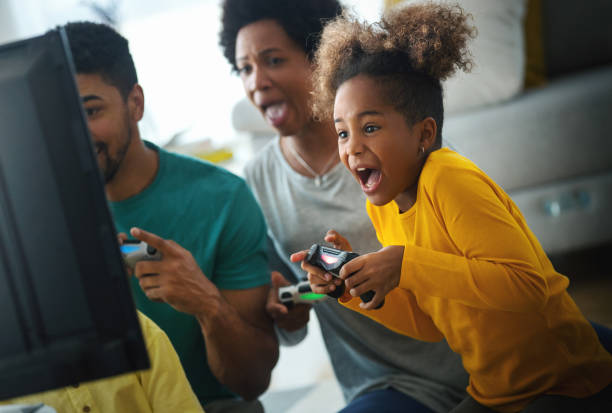 istock Family playing video games at home. 1223517585