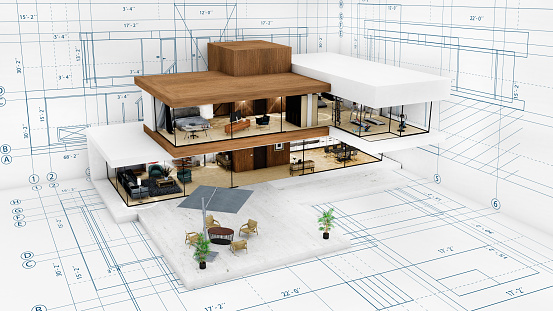 Planning a new city - Engineer-architect drawing with a pencil a sketch of a new modern imaginary town - concept image.