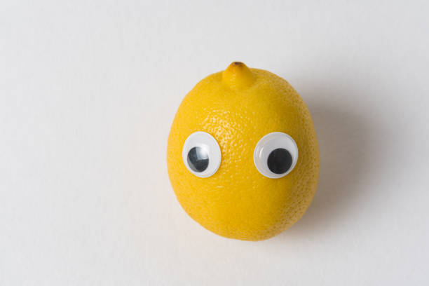 istock Fresh lemon with eyes on white background. Fruit with Funny Faces. 1223522747