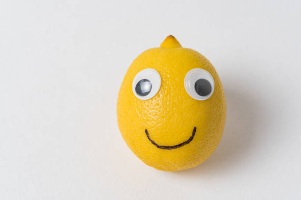 istock funny lemon fruit character. Ripe lemon with eyes and smile. creative idea. 1223522749