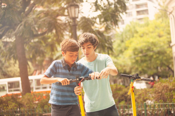 istock Happy boys using electric scooter in Buenos Aires city 1223522771