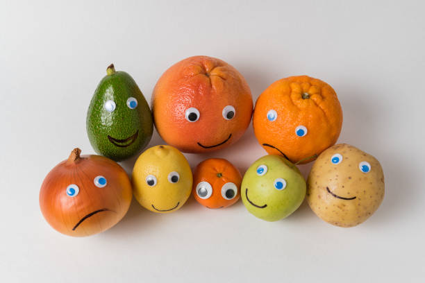 istock Fruits and vegetables with Googly eyes and painted smiles. multinational company concept 1223522821