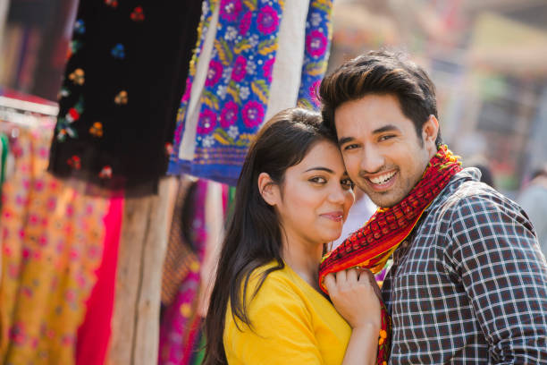 Young Couple buying dupatta at street market stock photo India, 25-29 Years, Adult, Adults Only, Annual Event india indian culture market clothing stock pictures, royalty-free photos & images