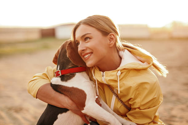 istock Cheerful lady hugging dog and smiling 1223524729