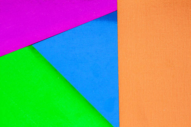 istock Background from multi-colored shiny cardboard. Needlework and children's art, made by hand. Orange, blue, green and magenta metallic colors 1223524859
