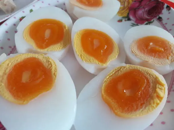 Halved boiled eggs, eaten with other Thai food