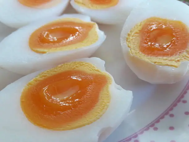 Halved boiled eggs, eaten with other Thai food