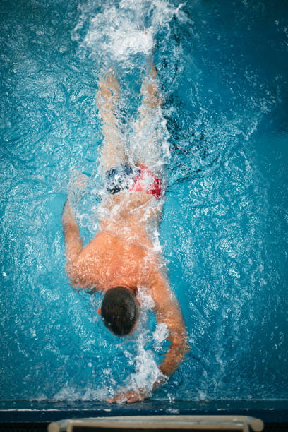istock Mature adult man swimming 1223527366