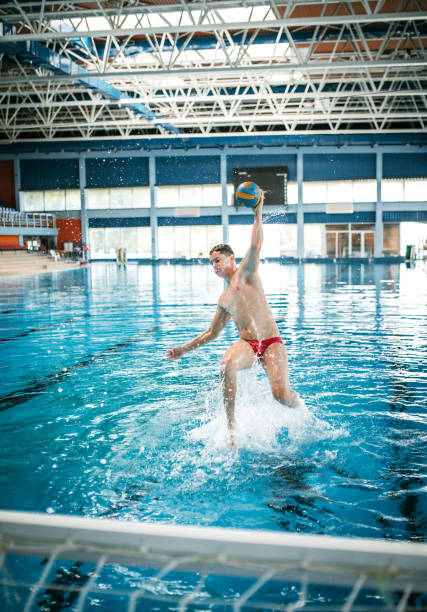 istock Fun with ball at swimming pool 1223528014
