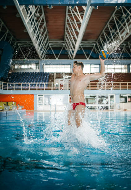 istock Fun with ball at swimming pool 1223528054