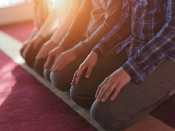 istock muslim people praying in mosque 1223528242