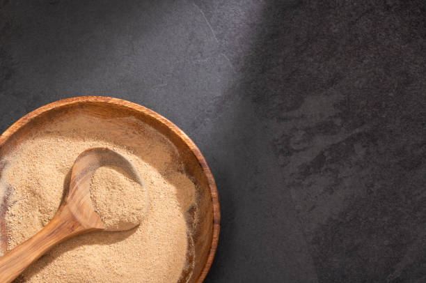 istock Lepidium meyenii - Maca powder in wooden spoon 1223534321
