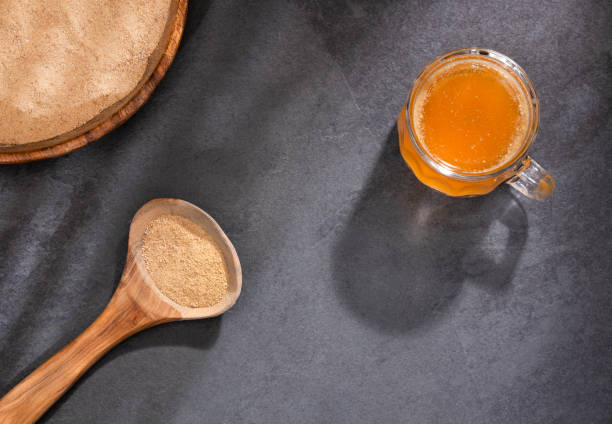 istock Lepidium meyenii - Maca root health drink in a glass with powdered 1223534347