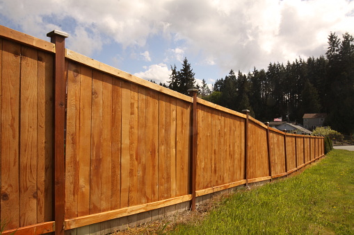 A new six feet tall wooden security fence