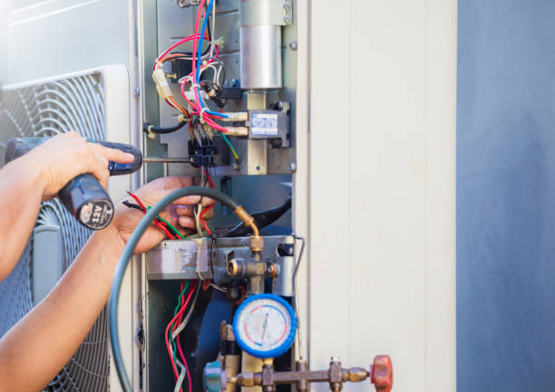 istock Male technician hands using a screwdriver fixing modern air conditioner, repairing and servicing, Maintenance and repairing concept 1223539358