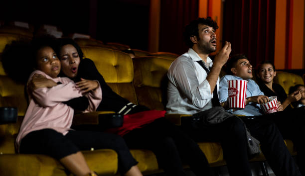 istock Shocked audience watching a horror movie 1223540663