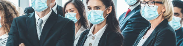 istock Confident business people with face mask protect from Coronavirus or COVID-19. 1223541314