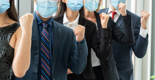 istock Confident business people with face mask protect from Coronavirus or COVID-19. 1223541332