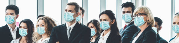 istock Confident business people with face mask protect from Coronavirus or COVID-19. 1223541366