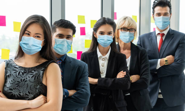 istock Confident business people with face mask protect from Coronavirus or COVID-19. 1223541373