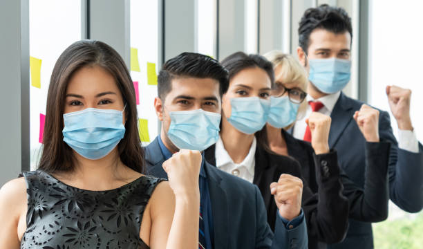istock Confident business people with face mask protect from Coronavirus or COVID-19. 1223541376