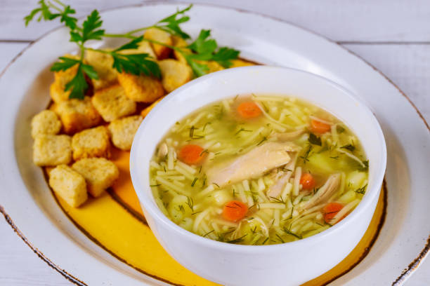 istock Noodle soup with chicken, parsley and croutons. 1223543987