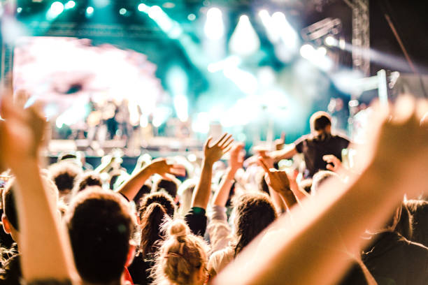 istock cheering crowd at rock concert 1223548158