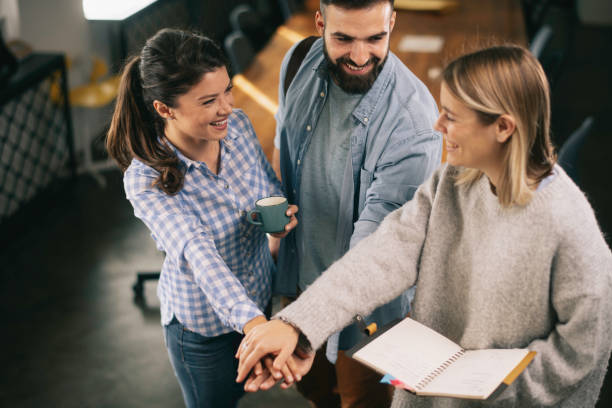 istock Succeessful team putting their hands together. 1223549812