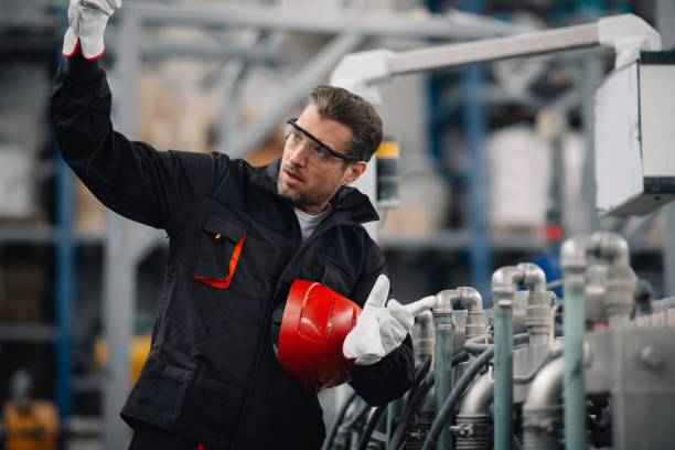 istock Handsome man working in factory. 1223550061