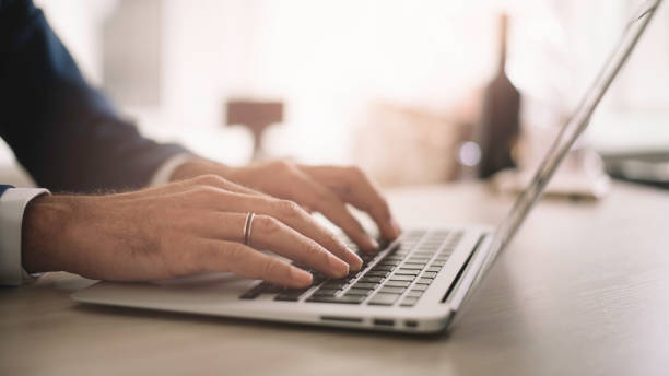 istock Close up of man working on lap top. 1223550139