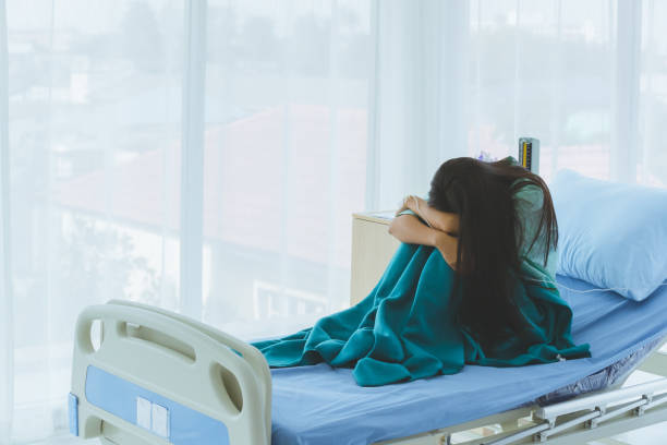 istock Female patient shows despair with her illness. 1223552020