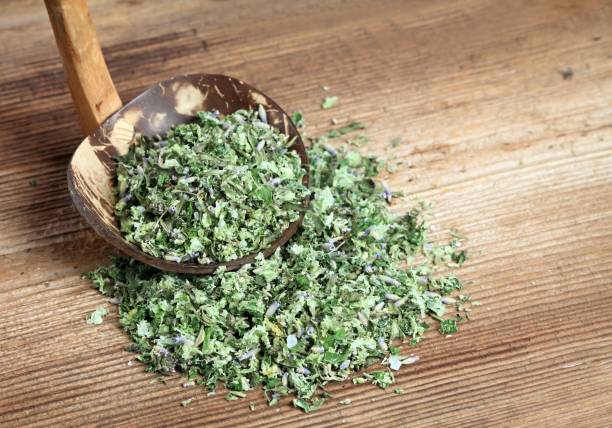 istock Homemade herbal salt from various herbs on the spoon. 1223552741
