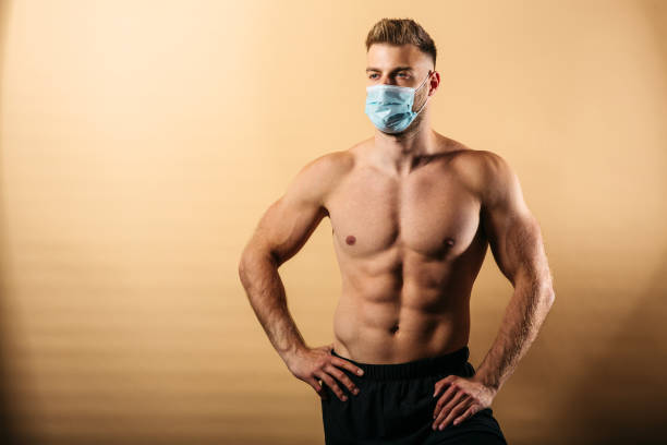 istock Young muscular male posing in studio 1223559221