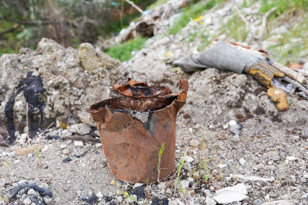 Litter in the desert, old rusty cans in Valley of the Gods. Spoiled nature by inconsiderate visitors. Can likely in the wild scenery for many years since arid climate would slow the aging process.