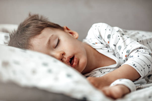 istock Photo of baby boy sleeping 1223560175