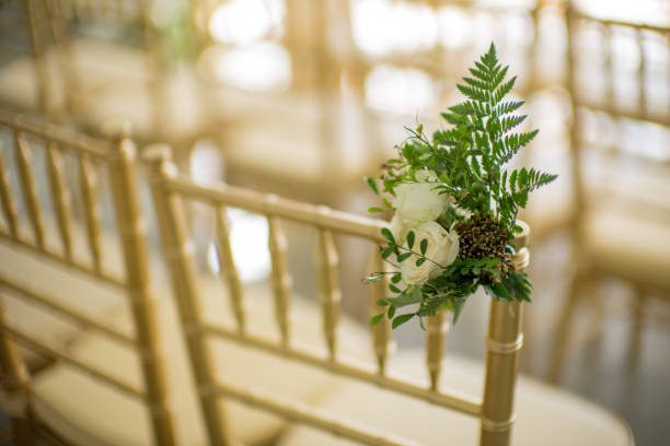 istock Flower decoration on chairs for garden wedding ceremony 1223560329