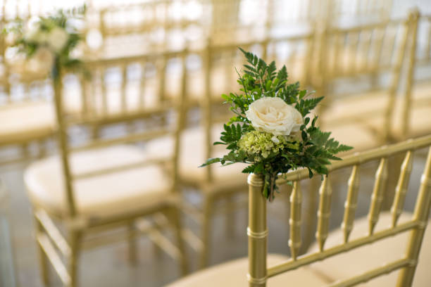 istock Flower decoration on chairs for garden wedding ceremony 1223560858