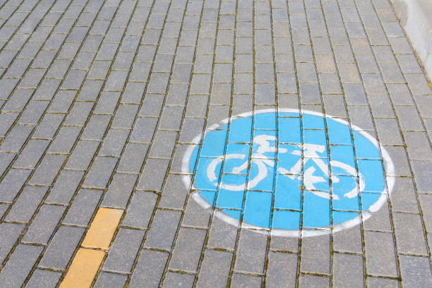 istock bike path and bike path sign on sidewalk tile. 1223562257