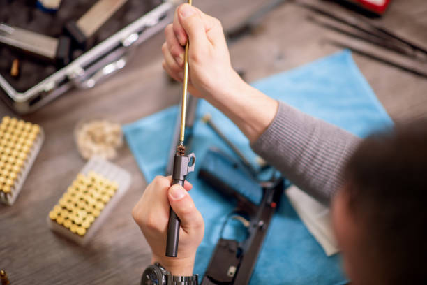 istock Man cleaning his pistol 1223563248