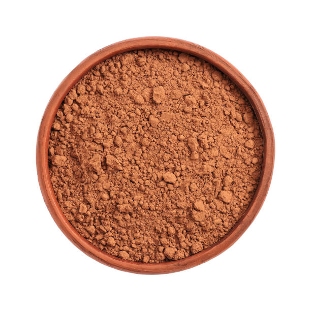 istock Cocoa powder in a bowl Isolated on a white background. Top view. 1223563738