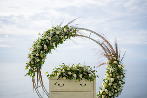 Outdoor garden wedding ceremony flower arch