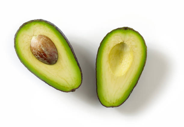 свежие спелые авокадо изолированы на белом - avocado portion fruit isolated стоковые фото и изображения